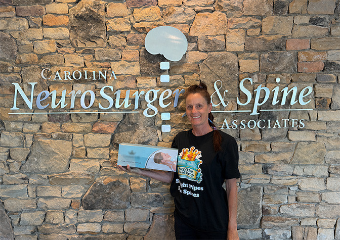 Danielle standing with CNSA logo