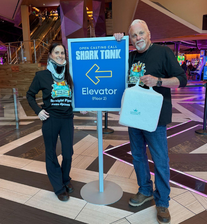 couple standing by directional sign